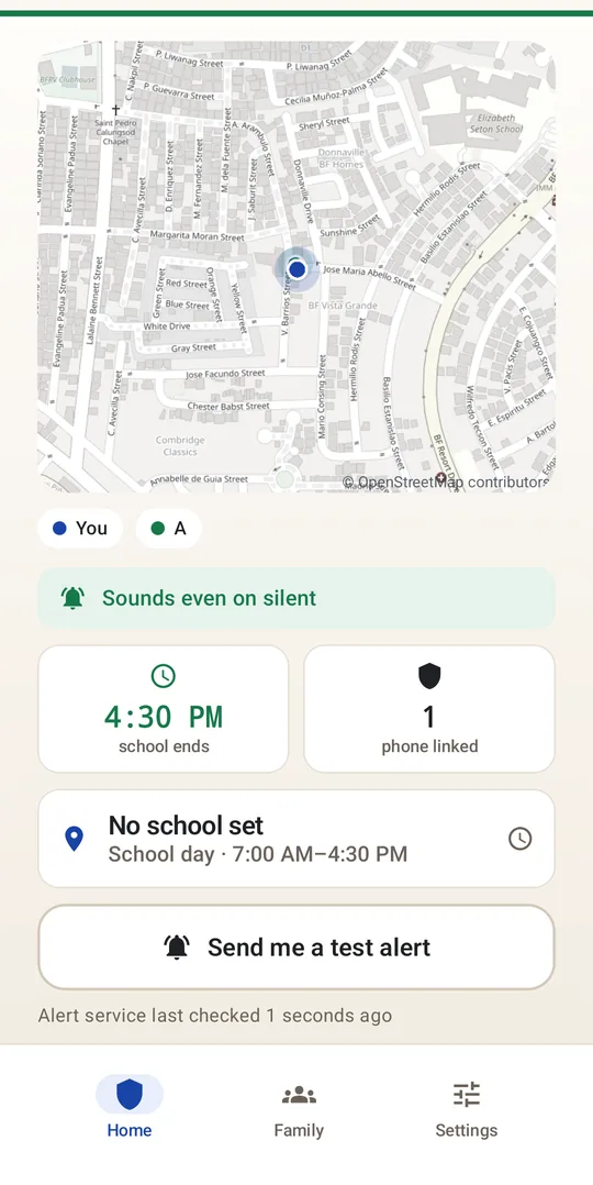 A guardian's home screen: a live map, presence chips for the guardian and their child, and a test alert button.